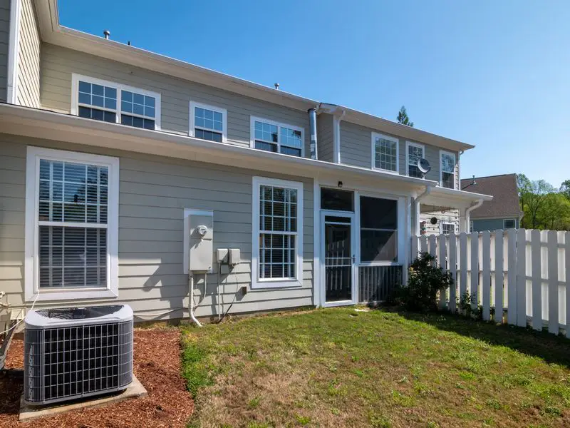 Townhome exterior with siding and gutters